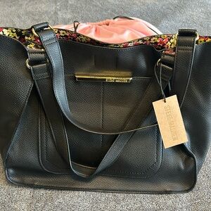Steve Madden black tote with floral coloring on the inside